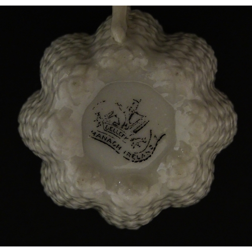 72 - A Belleek tea set in the Cone pattern, comprising teapot, milk jug, sugar bowl and four cups and sau... 