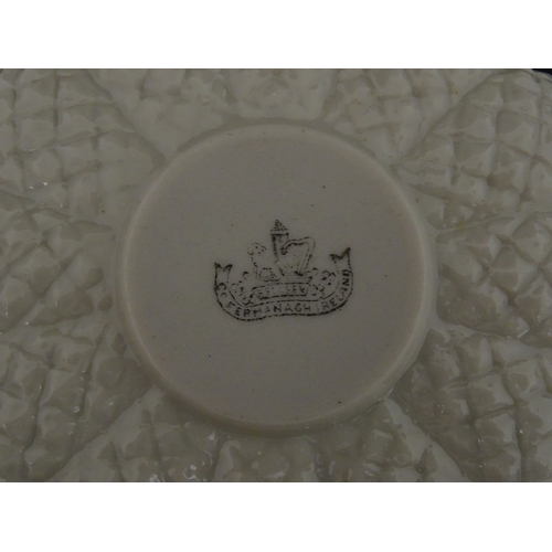 72 - A Belleek tea set in the Cone pattern, comprising teapot, milk jug, sugar bowl and four cups and sau... 