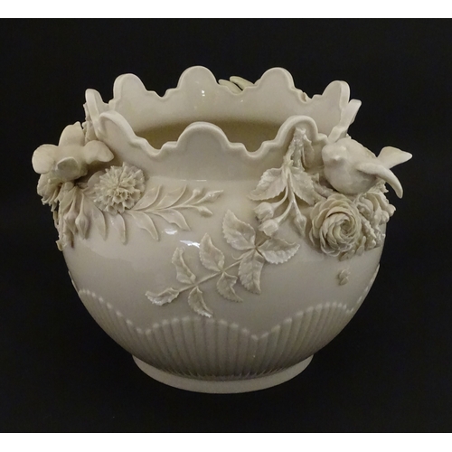 66 - A Belleek Rathmore jardiniere / planter decorated with birds, flowers and foliage. Marked with Secon... 