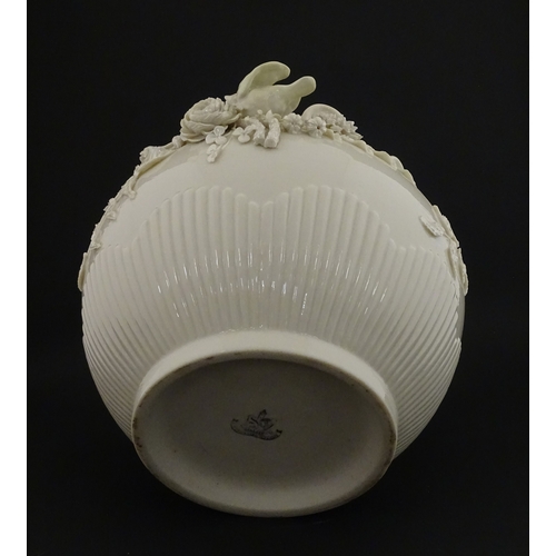 66 - A Belleek Rathmore jardiniere / planter decorated with birds, flowers and foliage. Marked with Secon... 