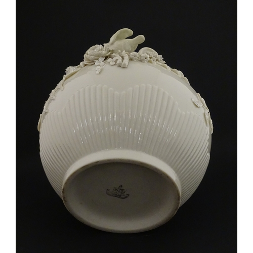 66 - A Belleek Rathmore jardiniere / planter decorated with birds, flowers and foliage. Marked with Secon... 