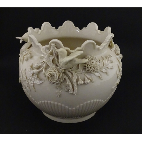 66 - A Belleek Rathmore jardiniere / planter decorated with birds, flowers and foliage. Marked with Secon... 