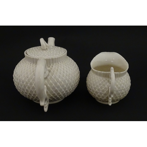 68 - Belleek tea wares in the Thistle pattern comprising teapot, milk jug and two cups and saucers. Marke... 