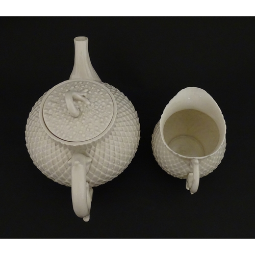 68 - Belleek tea wares in the Thistle pattern comprising teapot, milk jug and two cups and saucers. Marke... 