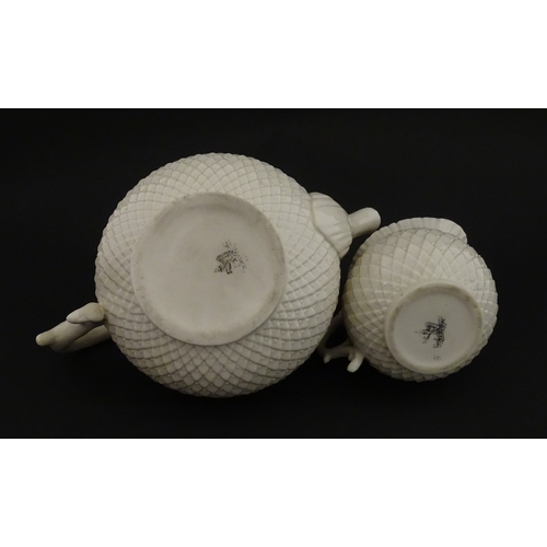68 - Belleek tea wares in the Thistle pattern comprising teapot, milk jug and two cups and saucers. Marke... 