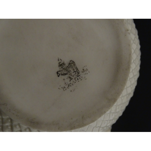 68 - Belleek tea wares in the Thistle pattern comprising teapot, milk jug and two cups and saucers. Marke... 