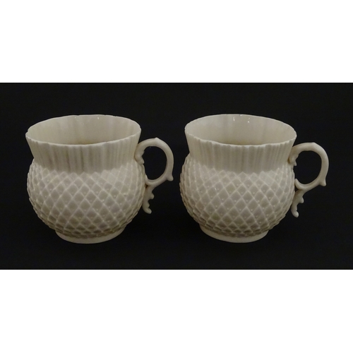 68 - Belleek tea wares in the Thistle pattern comprising teapot, milk jug and two cups and saucers. Marke... 