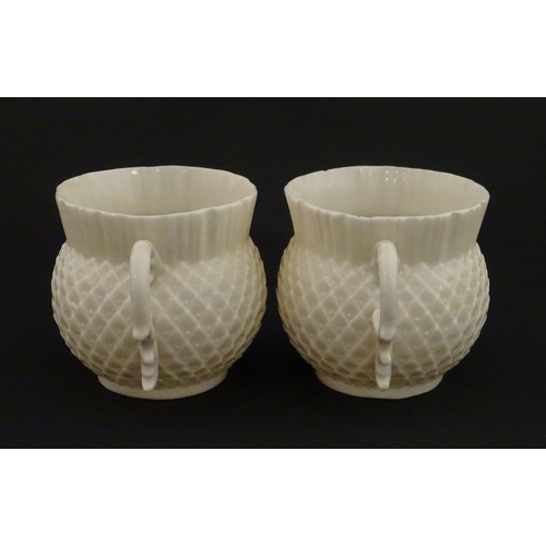 68 - Belleek tea wares in the Thistle pattern comprising teapot, milk jug and two cups and saucers. Marke... 