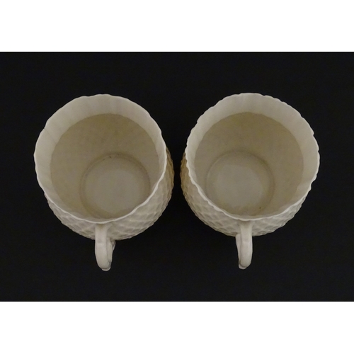 68 - Belleek tea wares in the Thistle pattern comprising teapot, milk jug and two cups and saucers. Marke... 