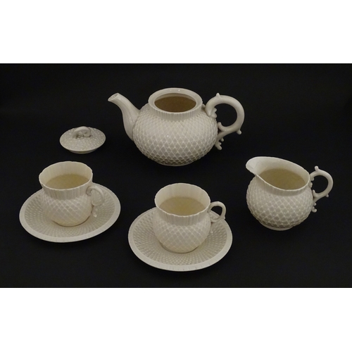68 - Belleek tea wares in the Thistle pattern comprising teapot, milk jug and two cups and saucers. Marke... 
