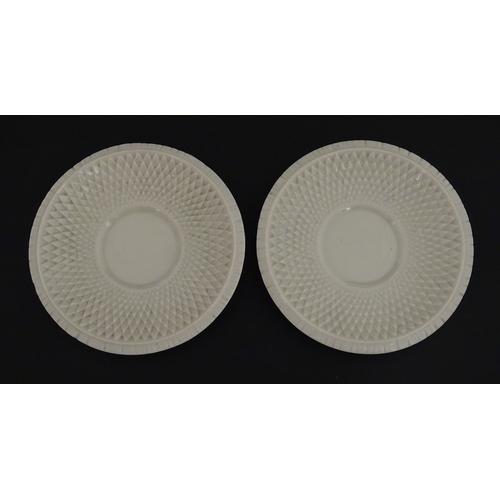 68 - Belleek tea wares in the Thistle pattern comprising teapot, milk jug and two cups and saucers. Marke... 