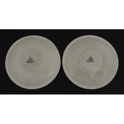 68 - Belleek tea wares in the Thistle pattern comprising teapot, milk jug and two cups and saucers. Marke... 