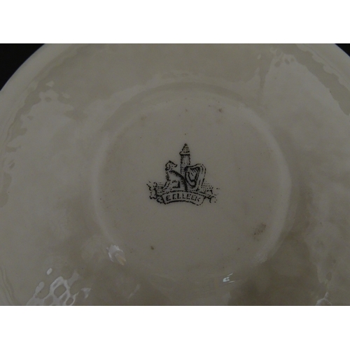 68 - Belleek tea wares in the Thistle pattern comprising teapot, milk jug and two cups and saucers. Marke... 