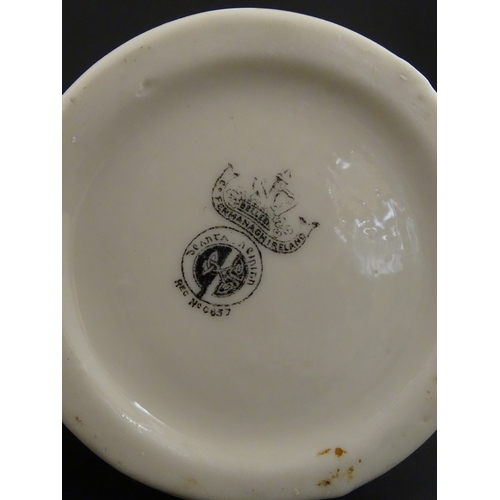 69 - A pair of Belleek vases in the Nile pattern having cala lily and foliate detail, with lustre highlig... 