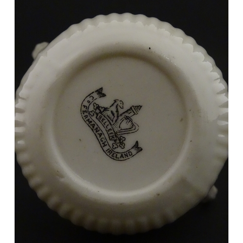 70 - A Belleek Lifford pattern double spout cream jug with twin handles. Marked with Second Period mark u... 