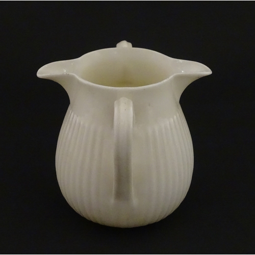 70 - A Belleek Lifford pattern double spout cream jug with twin handles. Marked with Second Period mark u... 