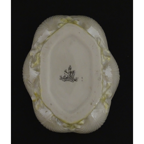 73 - A Belleek dish with shell decoration and lustre highlights. Marked with First Period mark under. App... 