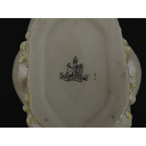 73 - A Belleek dish with shell decoration and lustre highlights. Marked with First Period mark under. App... 