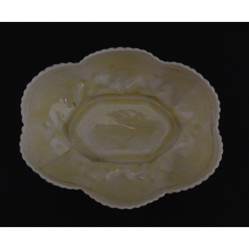 73 - A Belleek dish with shell decoration and lustre highlights. Marked with First Period mark under. App... 