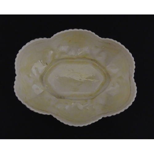 73 - A Belleek dish with shell decoration and lustre highlights. Marked with First Period mark under. App... 