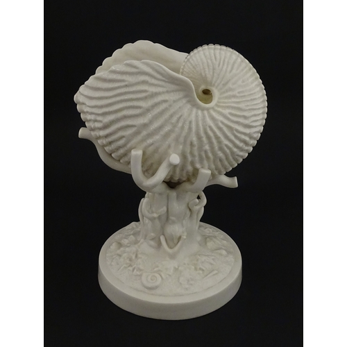 76 - A Belleek Cardium Shell on Coral centrepiece. Impressed with First Period mark under, and stamped wi... 