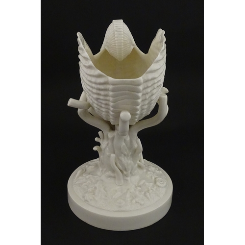 76 - A Belleek Cardium Shell on Coral centrepiece. Impressed with First Period mark under, and stamped wi... 