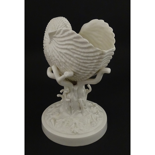 76 - A Belleek Cardium Shell on Coral centrepiece. Impressed with First Period mark under, and stamped wi... 