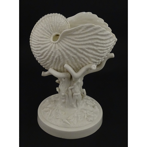 76 - A Belleek Cardium Shell on Coral centrepiece. Impressed with First Period mark under, and stamped wi... 