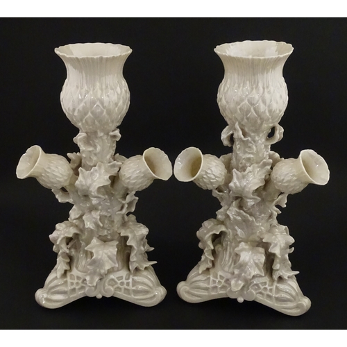 79 - A pair of Belleek Thistle vases with lustre detail. Marked with Second Period mark under. Approx. 10... 
