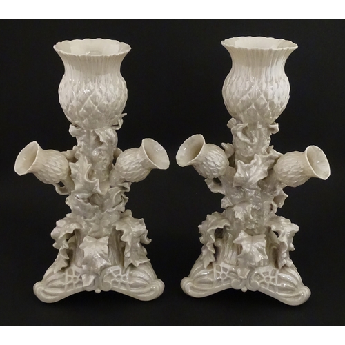 79 - A pair of Belleek Thistle vases with lustre detail. Marked with Second Period mark under. Approx. 10... 