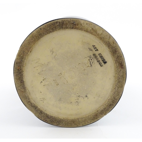 105 - A Royal Doulton vase with blue glaze and high relief dragon decoration to rim by Mark V Marshall. Ma... 