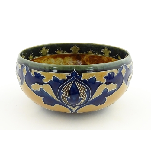 108 - A Royal Doulton Art Union of London stoneware bowl bowl with cobalt foliate decoration. Marked under... 