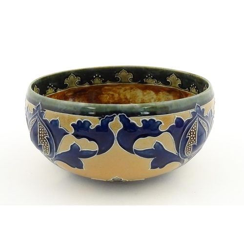 108 - A Royal Doulton Art Union of London stoneware bowl bowl with cobalt foliate decoration. Marked under... 