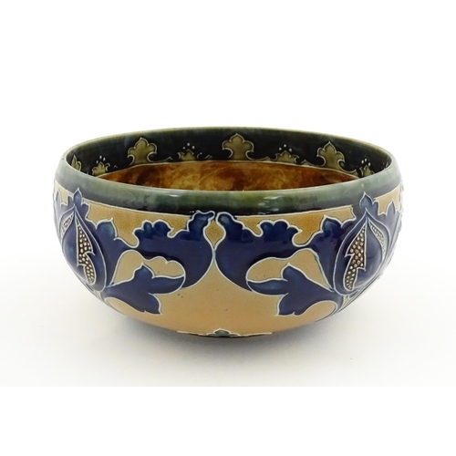 108 - A Royal Doulton Art Union of London stoneware bowl bowl with cobalt foliate decoration. Marked under... 