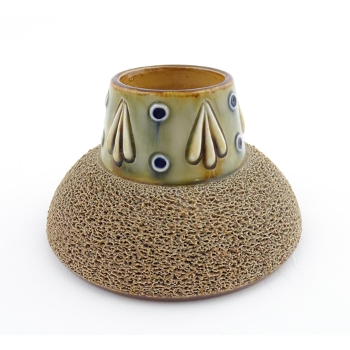 110 - A Royal Doulton stoneware match striker with stylised foliate detail to rim. Marked under. Approx. 2... 