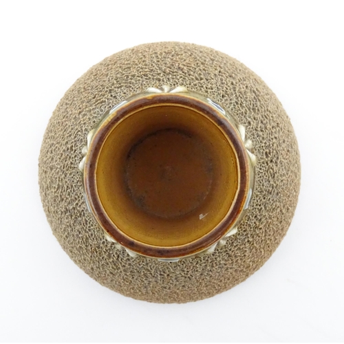 110 - A Royal Doulton stoneware match striker with stylised foliate detail to rim. Marked under. Approx. 2... 