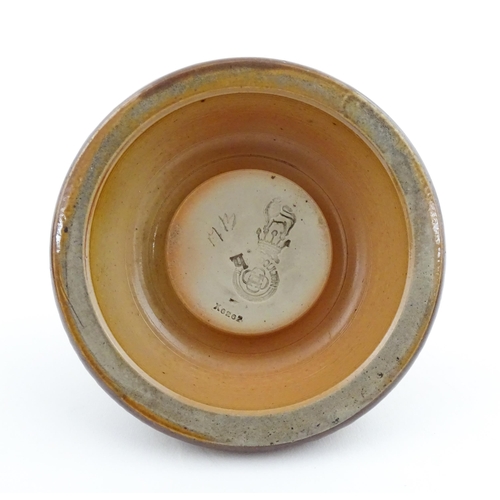 110 - A Royal Doulton stoneware match striker with stylised foliate detail to rim. Marked under. Approx. 2... 