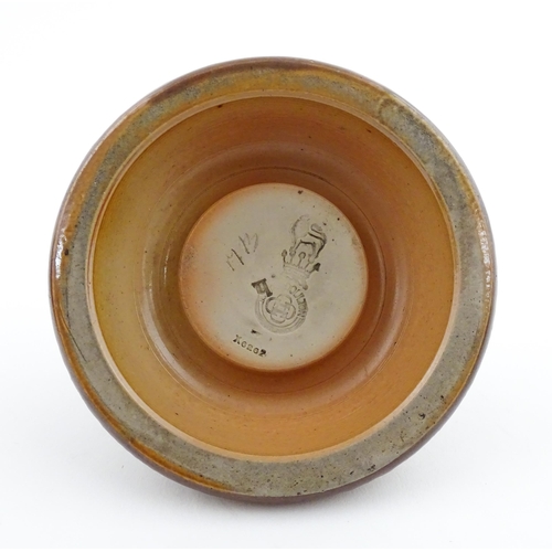110 - A Royal Doulton stoneware match striker with stylised foliate detail to rim. Marked under. Approx. 2... 