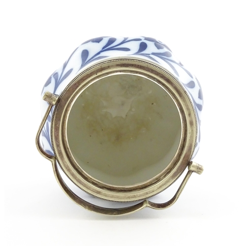 111 - A Doulton Burslem biscuit barrel of shaped form with blue and white floral and foliate decoration wi... 