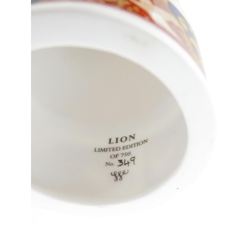 112 - A pair of Royal Worcester limited edition candle snuffers to commemorate HRH Queen Elizabeth's Golde... 