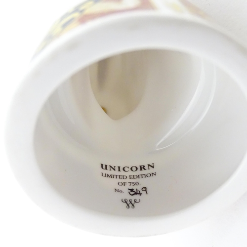 112 - A pair of Royal Worcester limited edition candle snuffers to commemorate HRH Queen Elizabeth's Golde... 