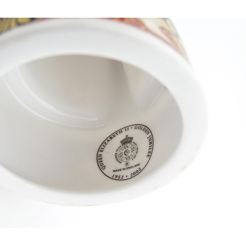 112 - A pair of Royal Worcester limited edition candle snuffers to commemorate HRH Queen Elizabeth's Golde... 