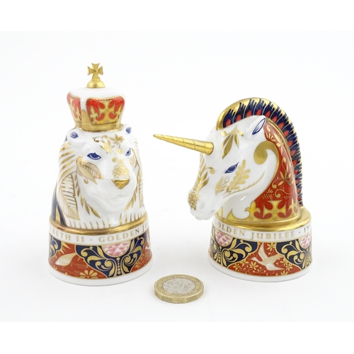 112 - A pair of Royal Worcester limited edition candle snuffers to commemorate HRH Queen Elizabeth's Golde... 