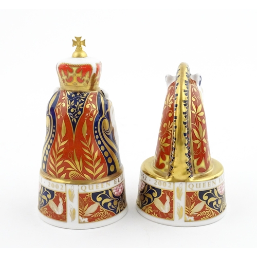 112 - A pair of Royal Worcester limited edition candle snuffers to commemorate HRH Queen Elizabeth's Golde... 