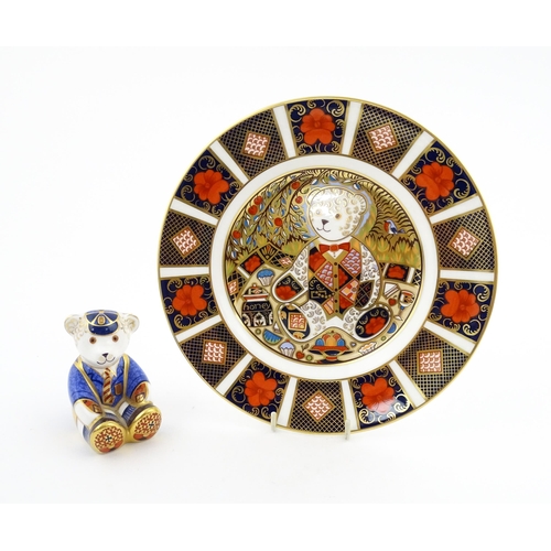 113 - A Royal Crown Derby paperweight modelled as a Schoolboy Teddy. Together with a boxed Royal Crown Der... 