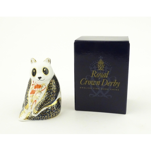 115 - A Royal Crown Derby paperweight modelled as a seated Panda. Boxed. Approx. 4 1/4