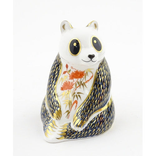 115 - A Royal Crown Derby paperweight modelled as a seated Panda. Boxed. Approx. 4 1/4