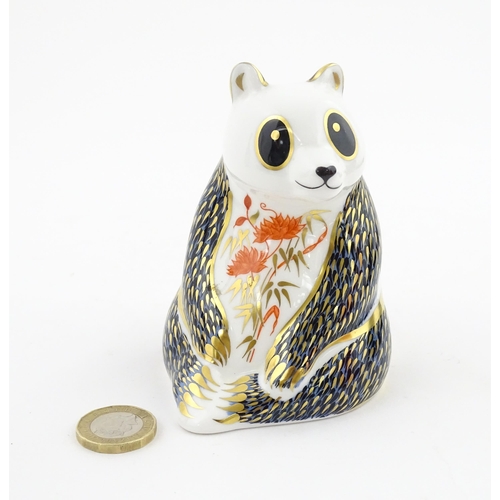 115 - A Royal Crown Derby paperweight modelled as a seated Panda. Boxed. Approx. 4 1/4