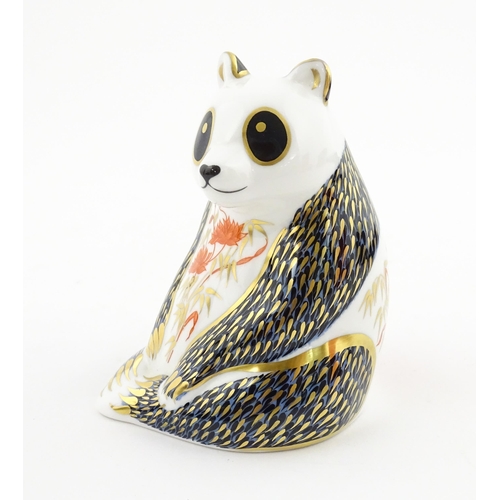 115 - A Royal Crown Derby paperweight modelled as a seated Panda. Boxed. Approx. 4 1/4