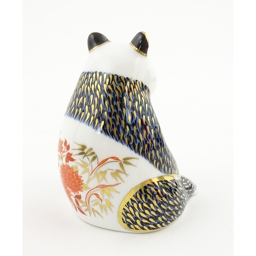 115 - A Royal Crown Derby paperweight modelled as a seated Panda. Boxed. Approx. 4 1/4